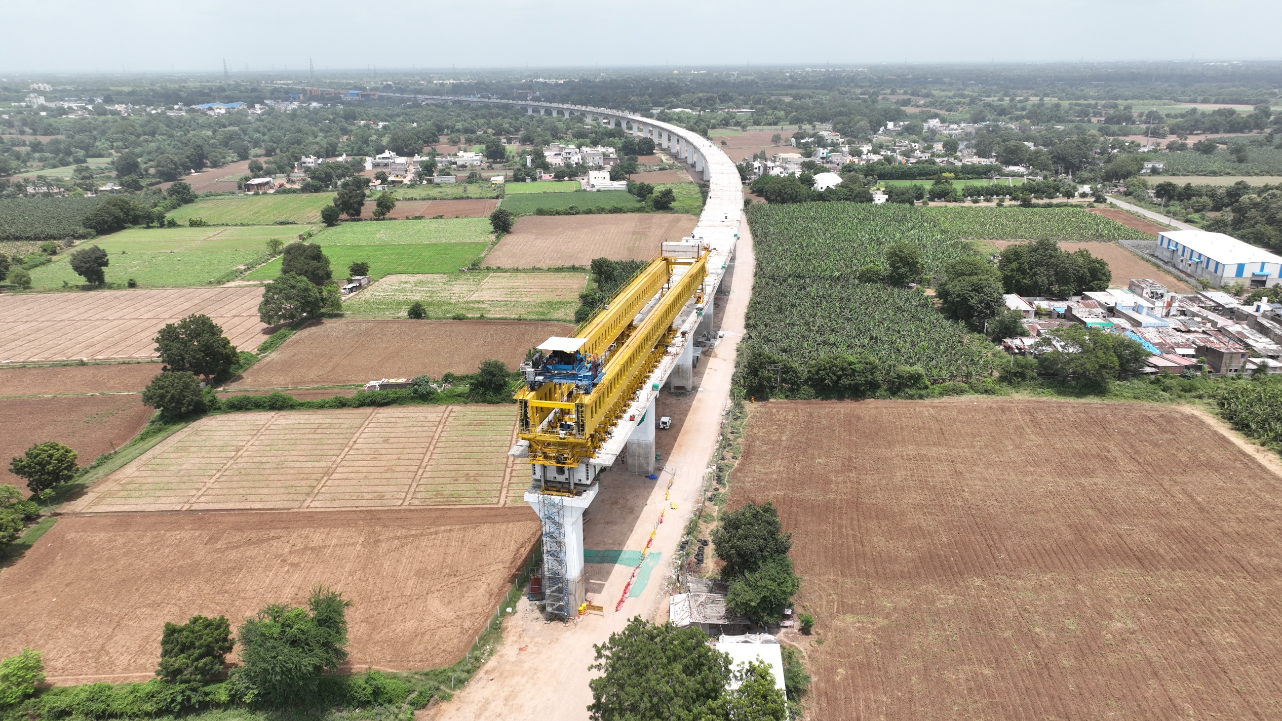 130 m span of a 230 m long steel bridge launched over NH-64 & Indian Railway tracks for Bullet Train Project